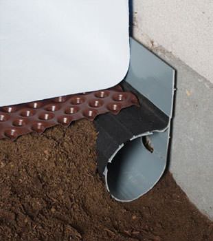 Closeup of a crawl space drainage system installed in Miller Place