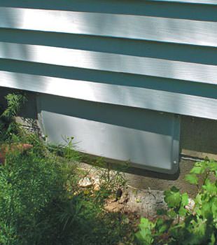 A gray crawl space vent cover in Valley Stream