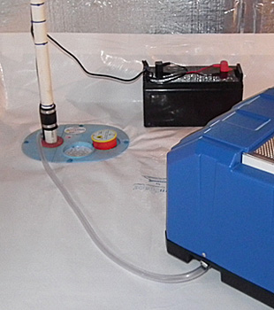 Closeup of a crawl space sump pump installed in Oakdale
