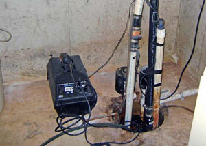 Pedestal sump pump system installed in a home in Babylon