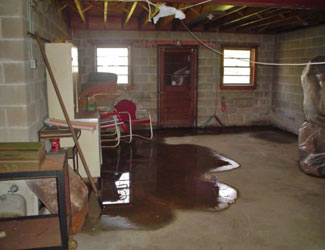 a flooded basement floor in a Patchogue home