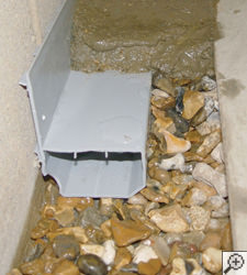 A no-clog basement french drain system installed in Oakdale