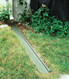 A recessed gutter drain extension installed in Woodmere, Long Island