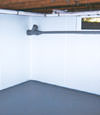 Great Neck, LI wet basement wall covering that tucks into a perimeter drainage system